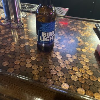 McBride's Pub & Grille - a beer bottle on a counter - Pubs Near Me - Plainfield, Illinois