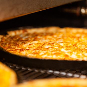 Pizza Inn - a pizza cooking in the oven - Pizza Near Me - Washington, North Carolina Pizza Inn - a pizza cooking in the oven - Pizza Near Me - Washington, North Carolina
