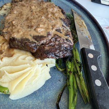 Chesapeake Inn Restaurant - Steak and gravy with mashed potatoes and broccolini - Seafood Near Me - Chesapeake City, Maryland Chesapeake Inn Restaurant - Steak and gravy with mashed potatoes and broccolini - Seafood Near Me - Chesapeake City, Maryland