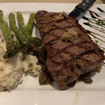 Shakers Bar & Grill - NY Strip Steak with mashed potatoes and asparagus - Seafood Near Me - Wixom, Michigan Shakers Bar & Grill - NY Strip Steak with mashed potatoes and asparagus - Seafood Near Me - Wixom, Michigan