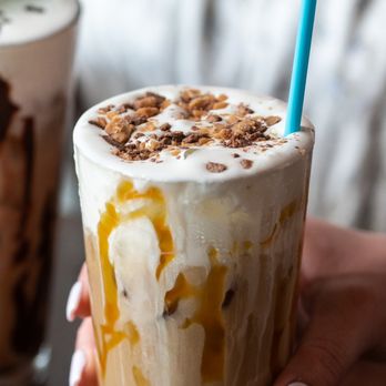 First Watch - a hand holding a cup of ice cream and caramel - Breakfast & Brunch Near Me - Aberdeen, North Carolina First Watch - a hand holding a cup of ice cream and caramel - Breakfast & Brunch Near Me - Aberdeen, North Carolina