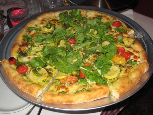 Photo of Addie's Pizza Pie - Berkeley, CA, US. Addie's pesto pizza with ricotta, roasted cherry tomatoes, squash, arugula