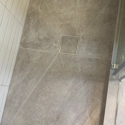 Before / After photo (shower curb and floor repair).