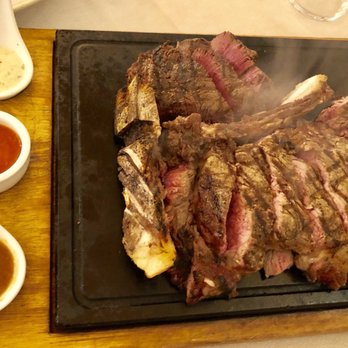 Trattoria dall'Oste - Steaming hot dry age steak on a hot plate with truffle creme - Trattorie Near Me - Florence, FI Trattoria dall'Oste - Steaming hot dry age steak on a hot plate with truffle creme - Trattorie Near Me - Florence, FI