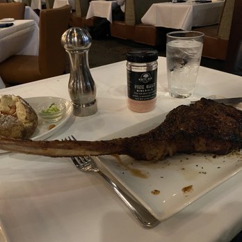 Sullivan's Steakhouse - Long-bone ribeye and baked potato. - Steakhouses Near Me - Anchorage, Alaska Sullivan's Steakhouse - Long-bone ribeye and baked potato. - Steakhouses Near Me - Anchorage, Alaska