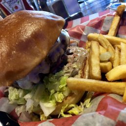 FAMOUS BURGER with Soon to be Famous Dressing, sautéed mushrooms/onions, bacon, & American Cheese with pickles and fries FAMOUS BURGER with Soon to be Famous Dressing, sautéed mushrooms/onions, bacon, & American Cheese with pickles and fries