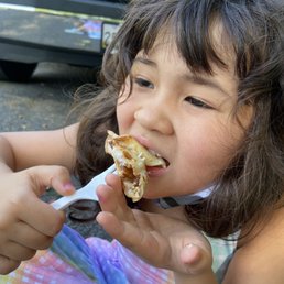 My daughter enjoying a s'mores crepe My daughter enjoying a s'mores crepe