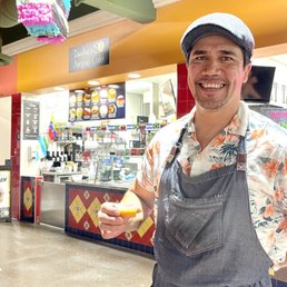 This is Dandino, owner and chef of Dandino's Arepas cafe who came our with a fresh batch of home made hot sauce to share with us!