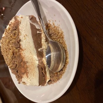 Mockingbird Kitchen - a piece of cake on a plate with a spoon - New American Near Me - Fayetteville, Arkansas