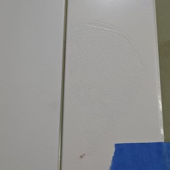 C&S Cabinets - No clue what this is, but this is how many of our reworked doors are. They likely put something on them when wet. Size of a softball. - Cabinetry Near Me - Fort Worth, Texas