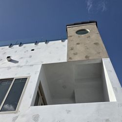 Shieldroof Services - 3rd floor, same flat Spanish tile goes all the way around the upper deck, stairwell and elevator shaft.