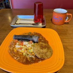 Legacy Cafe - Casa Benavides Baked egg- a crustless quiche smothered in red chili, beans and tortillas. I added the sausage patty.