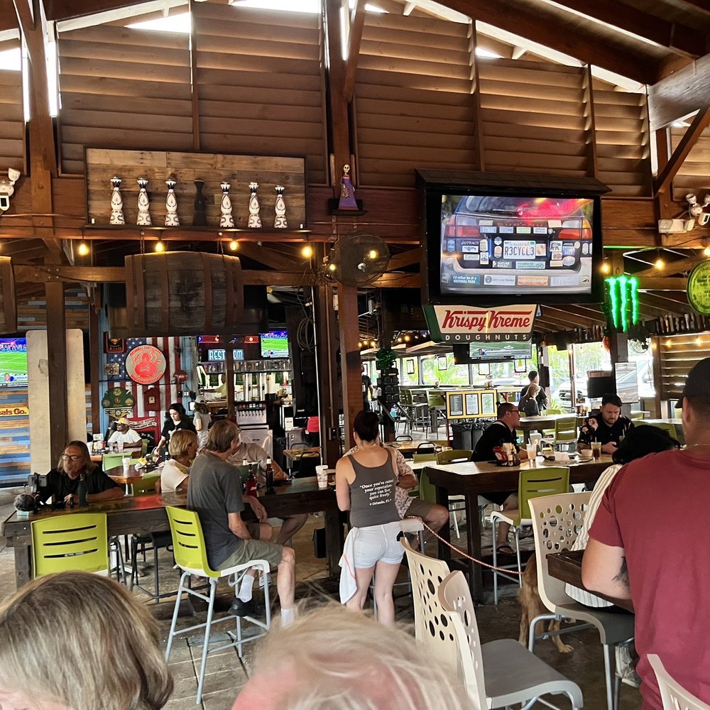 Johnny's Other Side - people sitting at tables in a restaurant - Sports Bars Near Me - Orlando, Florida