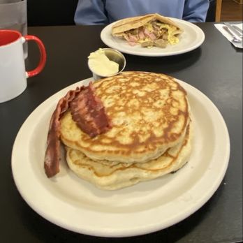 Eli's Place - Blueberry buckwheat pancakes with walnuts and turkey bacon and Jim's barnyard scramble in background - Breakfast & Brunch Near Me - Lawrence, Massachusetts Eli's Place - Blueberry buckwheat pancakes with walnuts and turkey bacon and Jim's barnyard scramble in background - Breakfast & Brunch Near Me - Lawrence, Massachusetts