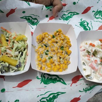Ember Smoke - Jalapeño pineapple slaw, jalapeño creamed corn, and white potato salad with curtido. - Tacos Near Me