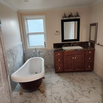 GMR Construction - a bathroom with a claw foot bathtub - General Contractors Near Me GMR Construction - a bathroom with a claw foot bathtub - General Contractors Near Me