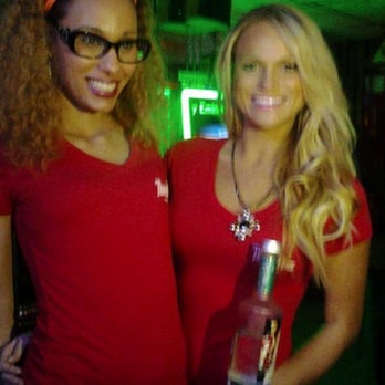 Rooftops Bar & Grill - two women holding a bottle of vodka - Bars Near Me - Buffalo, New York Rooftops Bar & Grill - two women holding a bottle of vodka - Bars Near Me - Buffalo, New York