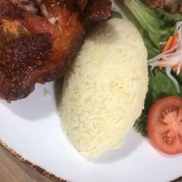 Crispy Fried Golden Chicken on Yellow Rice Crispy Fried Golden Chicken on Yellow Rice