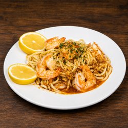 Red Crab Juicy Seafood - Cajun shrimp pasta tossed in savory garlic butter with fresh lemon--juicy shrimp, bold seasoning and flavor in every forkful.