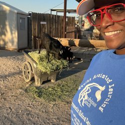 Robinson Ranch - Hey... look at me... having fun with the baby goats while working a volunteer maintenance shift!
