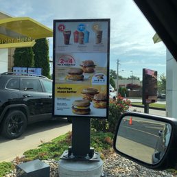 a sign in front of a car