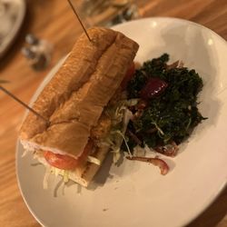 The Corner Grille - Upper West Side - Shrimp po boy with sautéed kale, renditions and garlic