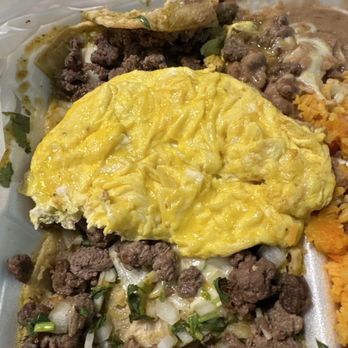 El Burrito Tapatio - Onions on the chilaquiles. Eggs how ever they decided to do them. Never asked how I wanted my eggs. - Mexican Near Me - Addison, Illinois
