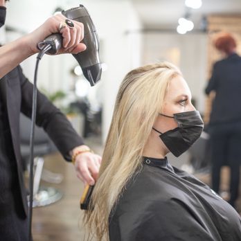Ivy + Oak Salon - Stylist blow drying long, blonde hair - Hair Salons Near Me - Denver, Colorado Ivy + Oak Salon - Stylist blow drying long, blonde hair - Hair Salons Near Me - Denver, Colorado