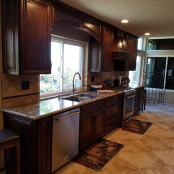 Protex Construction - Kitchen after...removed the peninsula, raised the ceiling, and removed the wall... - General Contractors Near Me