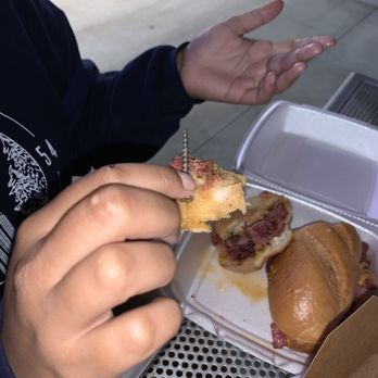 R Burgers - pastrami sandwich with a huge nail inside it - Burgers Near Me - Riverside, California R Burgers - pastrami sandwich with a huge nail inside it - Burgers Near Me - Riverside, California