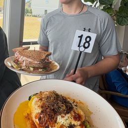 Avocado toast, club sandwich, server boy Avocado toast, club sandwich, server boy