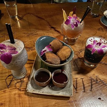 Wilfred's Lounge - Uma Ube (left), Maximum Aloha (top), Napa Sour (right), and Malasadas (center) - Hawaiian Near Me - Napa, California Wilfred's Lounge - Uma Ube (left), Maximum Aloha (top), Napa Sour (right), and Malasadas (center) - Hawaiian Near Me - Napa, California