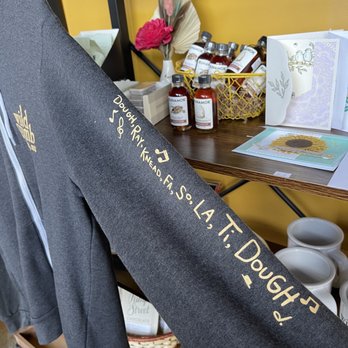 Wild Crumb - a t - shirt hanging on a shelf - Coffee & Tea Near Me - Bozeman, Montana Wild Crumb - a t - shirt hanging on a shelf - Coffee & Tea Near Me - Bozeman, Montana
