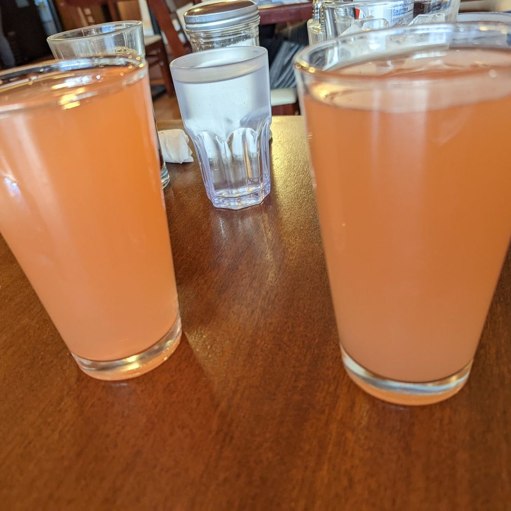 The Greene Lily - Pint glasses of strawberry guava mimosa and pink grapefruit mimosa. They're amazing and part of a large selection of specialty mimosas! - Breakfast & Brunch Near Me - Eureka, California