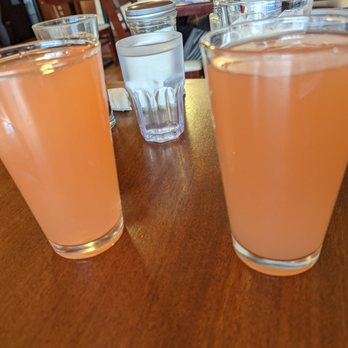 The Greene Lily - Pint glasses of strawberry guava mimosa and pink grapefruit mimosa. They're amazing and part of a large selection of specialty mimosas! - Breakfast & Brunch Near Me - Eureka, California