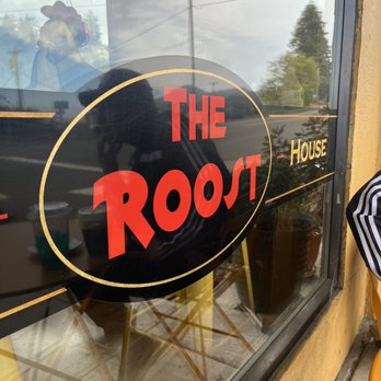 The Roost - a woman sitting outside a restaurant - Coffee & Tea Near Me - Wheeler, Oregon