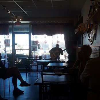 Around the World Cafe Bakery - The owner playing during brunch. - Cafes Near Me - Indialantic, Florida