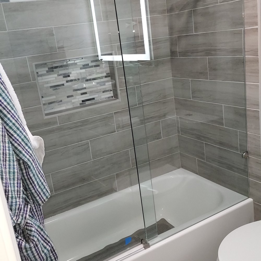 LegacyTec Roofing & Construction - a bathroom with a shower, toilet, and bathtub - Roofing Near Me