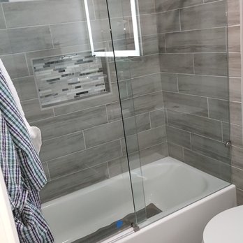 LegacyTec Roofing & Construction - a bathroom with a shower, toilet, and bathtub - Roofing Near Me LegacyTec Roofing & Construction - a bathroom with a shower, toilet, and bathtub - Roofing Near Me