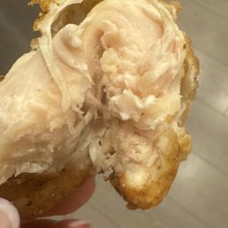 Undercooked chicken tender in a kid's meal Undercooked chicken tender in a kid's meal