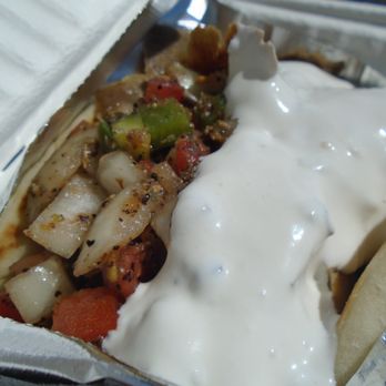 Kevin’s Gyros - Lamb gyro, close-up. - Mediterranean Near Me Kevin’s Gyros - Lamb gyro, close-up. - Mediterranean Near Me