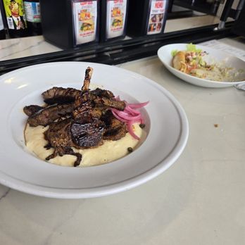 La'Caj Seafood - Cajun lamb lollipops and grits - Seafood Near Me - Camp Springs, Maryland La'Caj Seafood - Cajun lamb lollipops and grits - Seafood Near Me - Camp Springs, Maryland