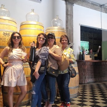 Your Vacation Finders - Dream Vacations - Wine tasting with the ladies at Bodegas de Santo Tomàs Cheers! - Travel Agents Near Me