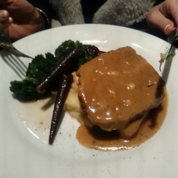 Madison's Restaurant - Meatloaf on a bed of mashed potatoes, with perfectly roasted broccoli and purple carrots. - New American Near Me - Highlands, North Carolina