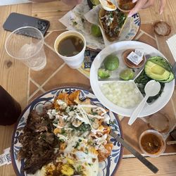 El Chivito Birrieria - Chilaquiles Plate with Birria and 2 Eggs / Tacos Dorados.