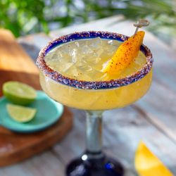 Bahama Breeze - Hot Honey Mango Margarita - Casamigos Reposado Tequila, mango, hot honey and bitters with a sweet and spicy rim