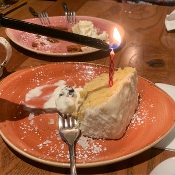 Knoxie's Table - Devoured key lime pie in the background & Coconut cake with many layers and a birthday candle. - American Near Me - Stevensville, Maryland Knoxie's Table - Devoured key lime pie in the background & Coconut cake with many layers and a birthday candle. - American Near Me - Stevensville, Maryland