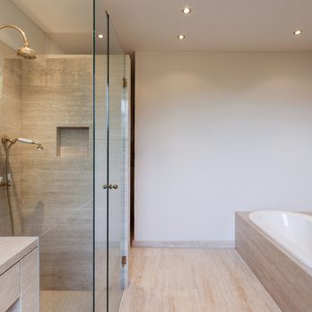 Duncan Remodeling - a modern bathroom with a walk in shower - Flooring Near Me Duncan Remodeling - a modern bathroom with a walk in shower - Flooring Near Me