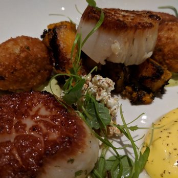 Brim House - Day boat scallops with crispy risotto, squash, puffed sorghum over avacado aioli with smoked egg aioli as well. - American Near Me - Toledo, Ohio Brim House - Day boat scallops with crispy risotto, squash, puffed sorghum over avacado aioli with smoked egg aioli as well. - American Near Me - Toledo, Ohio
