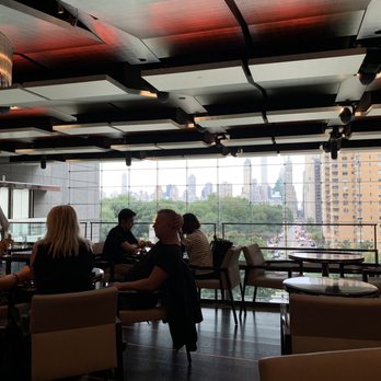 Center Bar - people sitting at tables in a restaurant - Lounges Near Me - New York, New York Center Bar - people sitting at tables in a restaurant - Lounges Near Me - New York, New York